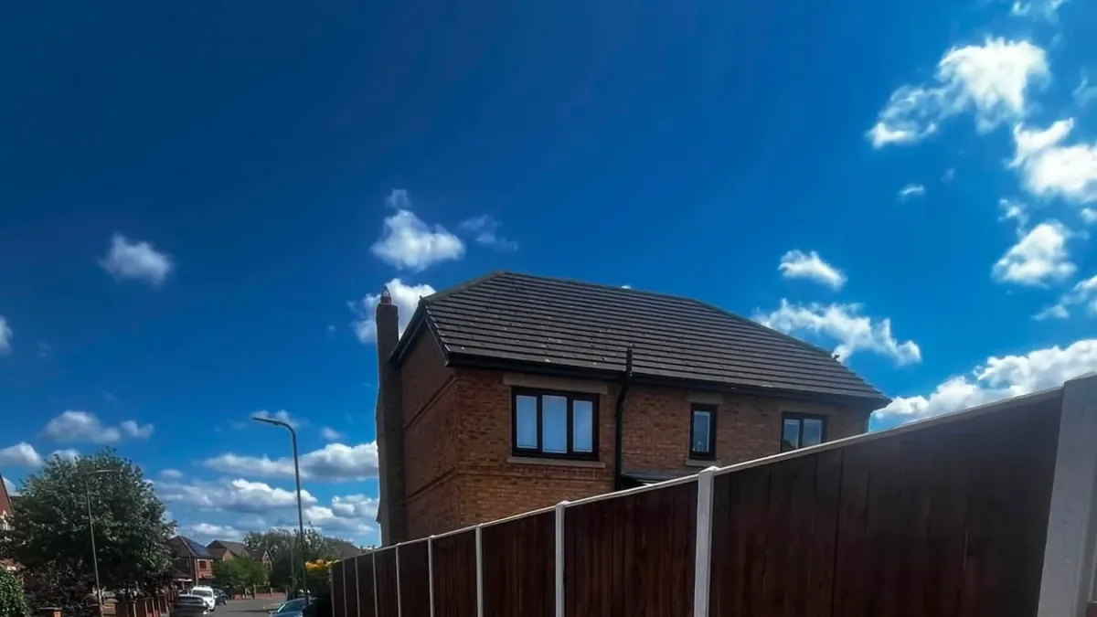 Close-board fence panels stained dark oak