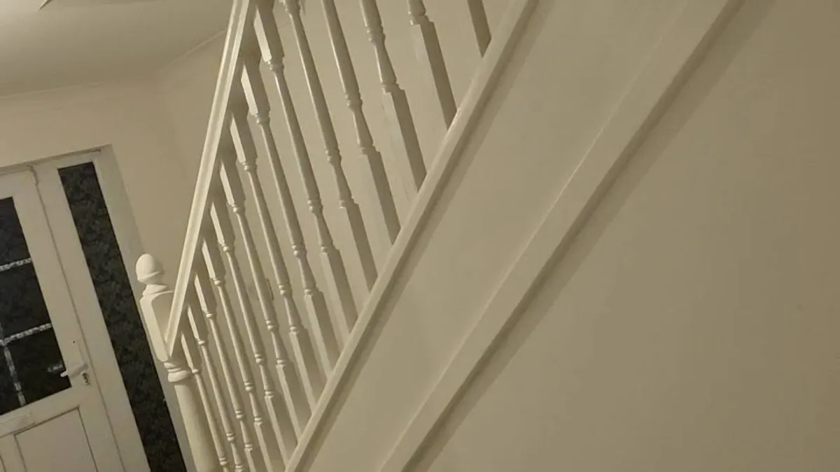 Staircase spindles and panelling painted white