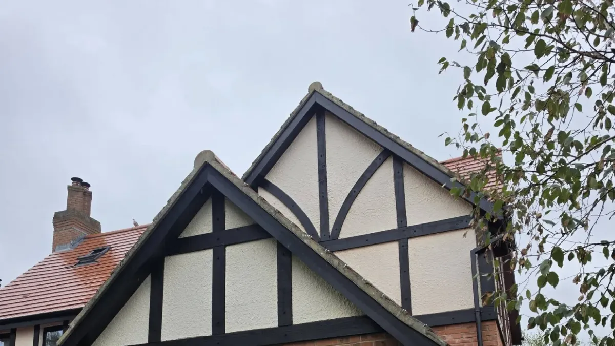 Mock Tudor gable with freshly painted black timbers and cream render